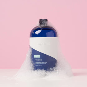 Capri Blue Volcano refill being poured into a pump bottle for convenient refill benefit
