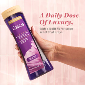 Styled bathroom shelf with Caress bottle adding a fragrant, upscale touch to the shower space
