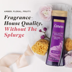 Rich creamy lather from Caress body wash demonstrating fluffy foam and skin-softening texture