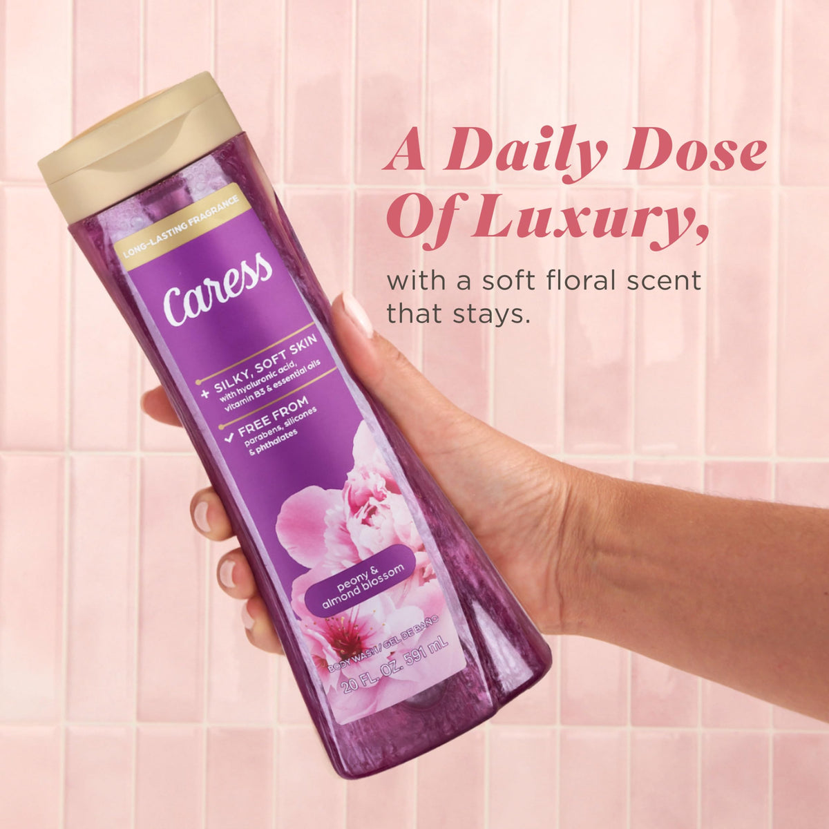 Hand holding Caress bottle for scale showing convenient 20 fl oz size