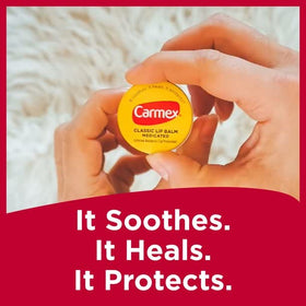 Carmex label close-up showing ingredients like camphor and menthol clearly