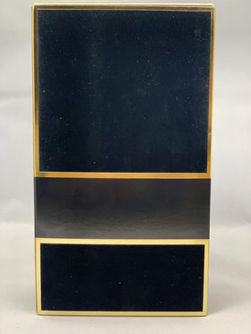 Carolina Herrera Bad Boy glass finish texture closeup shows refined craftsmanship and grip