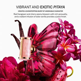 Carolina Herrera La Bomba spray mist in motion illustrating fine diffusion and quick coverage