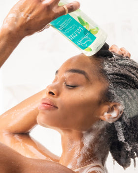 Carol's Daughter focused nozzle delivering liquid for precise scalp access