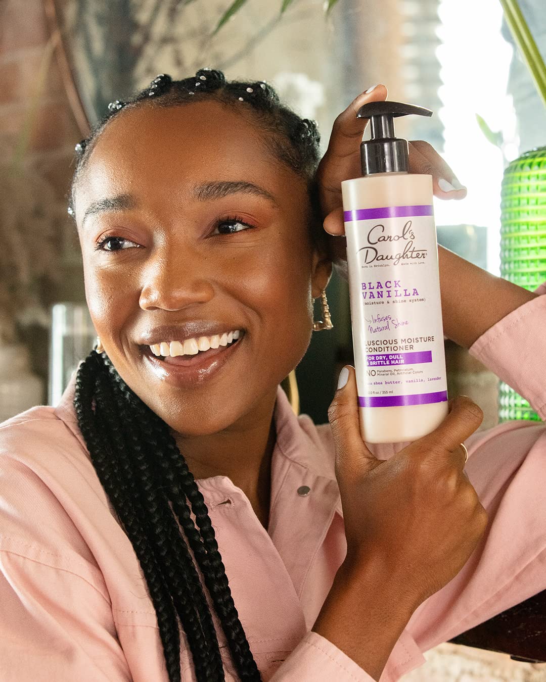 Carol's Daughter Black Vanilla duo staged on bathroom shelf suggesting daily routine