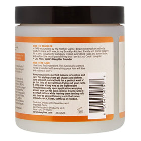Carol's Daughter cream-gel texture close-up demonstrating smooth slip and moisturizing feel