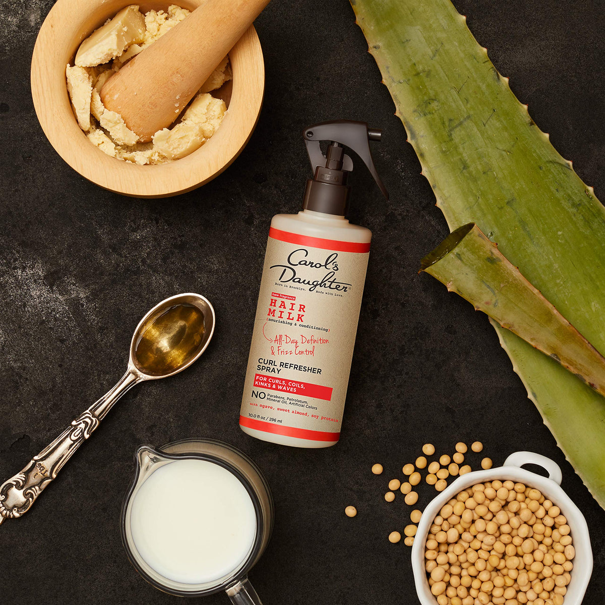 Carol's Daughter drop of product texture showing lightweight formula and moisturize benefit