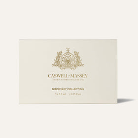 Caswell-Massey Distiller’s Lounge spray in use suggesting warm, evening depth