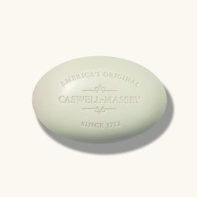 Caswell-Massey bar staged in bathroom setting, suggesting daily grooming routine benefit