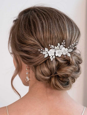 Catery front view of silver flower bridal hair comb showing floral rhinestones and sparkle