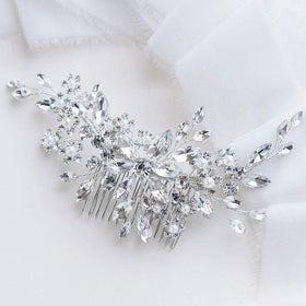 Catery bridal hair comb front view showing silver rhinestones and floral design for elegance