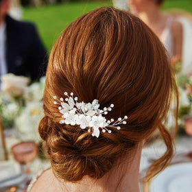 Catery comb placed in bridal updo demonstrating secure hold and elegant finish