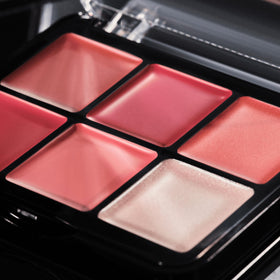 Catrice Cosmetics palette beside essentials conveying quick touch-up convenience