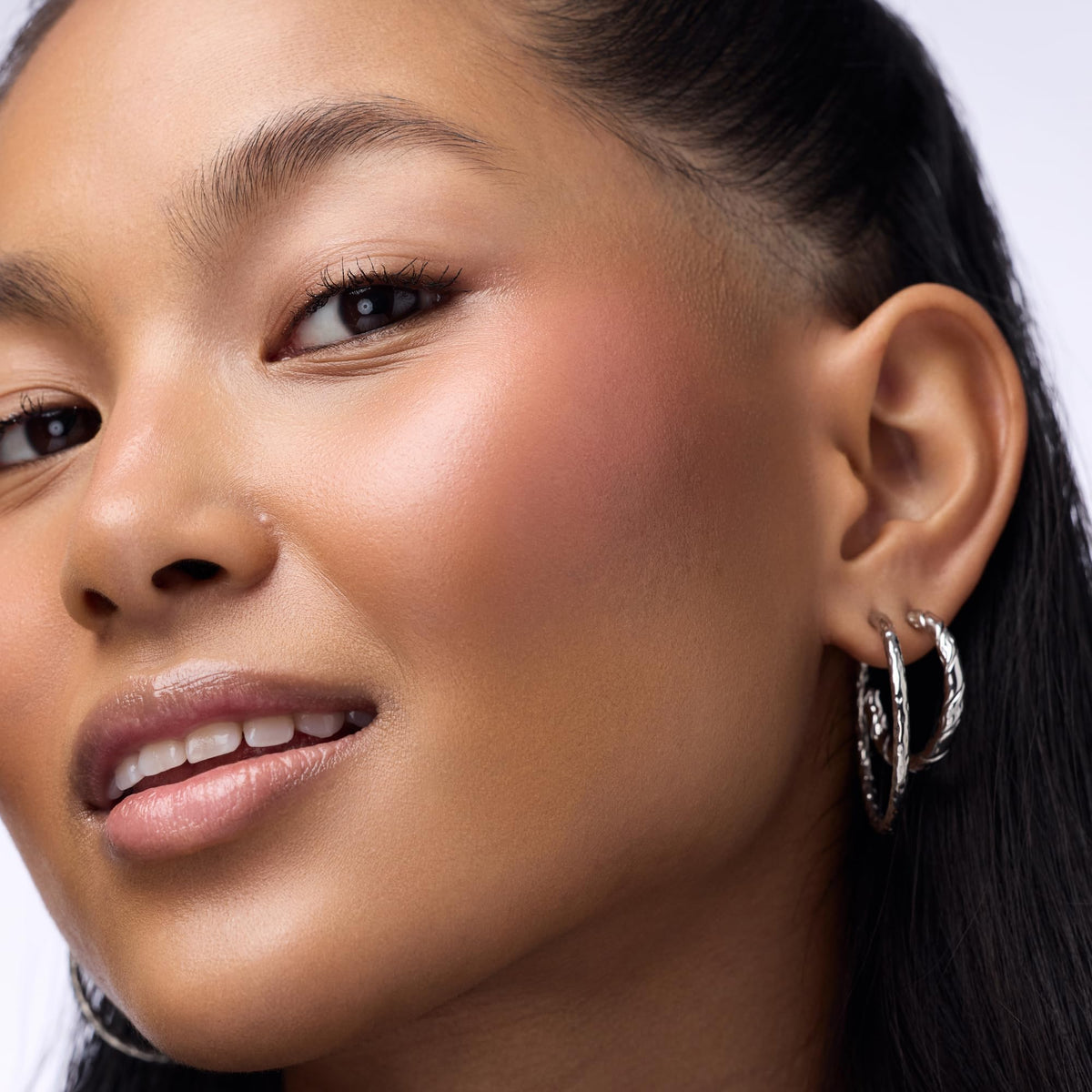 Catrice multi stick in hand to show pocket-friendly size benefit