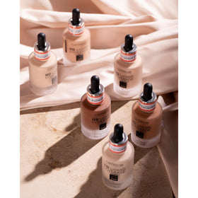 Catrice bottle in hand showing compact size and travel-friendly benefit