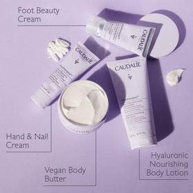 Caudalie 75 mL tube next to a hand to illustrate size and convenient travel-friendly volume