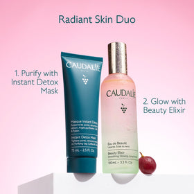 Caudalie bottle next to a hand for scale, displays the compact 100 mL size