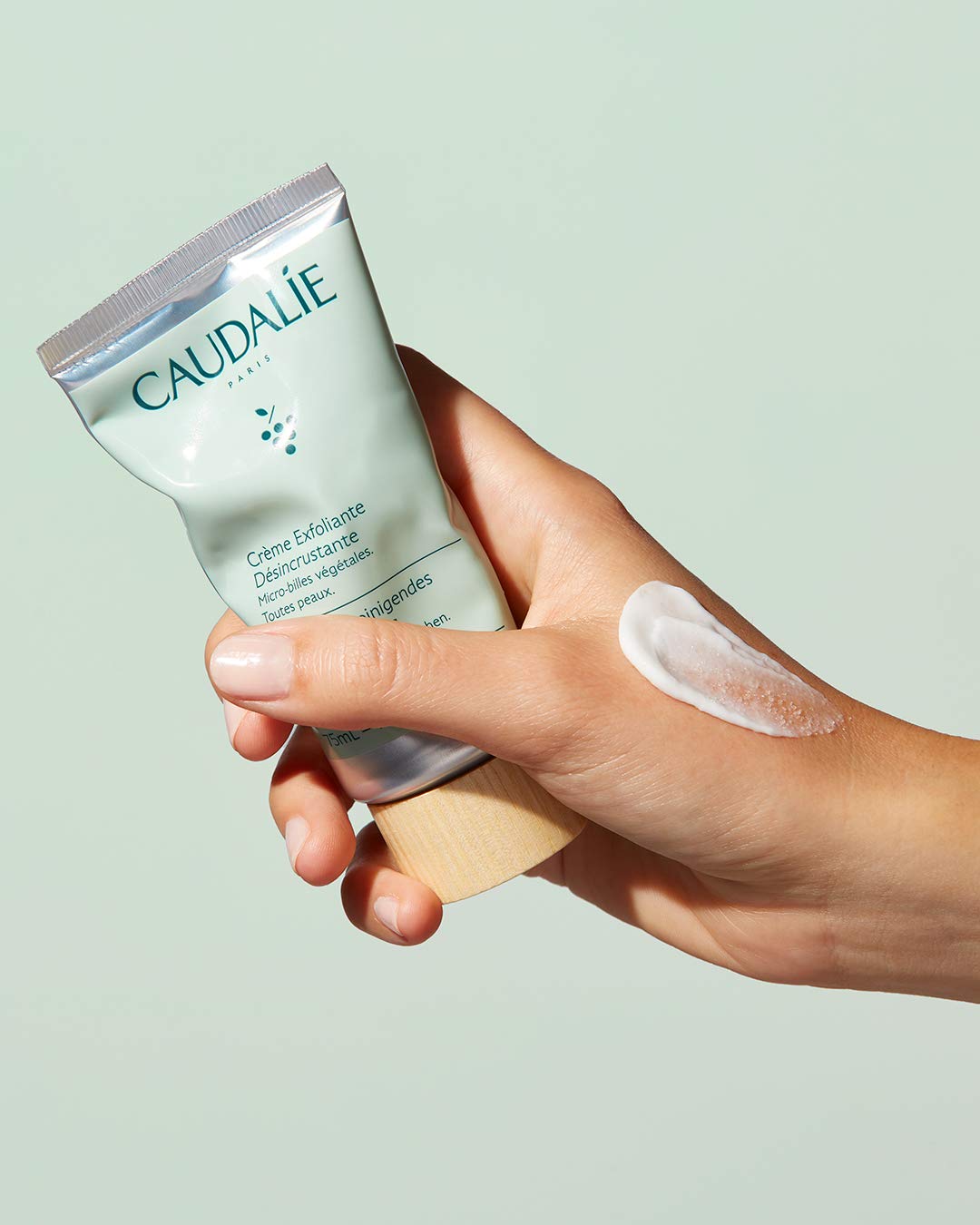 Caudalie product being applied to hand demonstrating easy spread and refreshing feel
