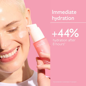Bottle of organic grape water ingredient with Caudalie branding, emphasizes soothing antioxidants