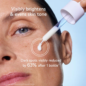 Caudalie pipette dispensing clear serum texture demonstrating lightweight absorption benefit