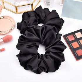 CEELGON scrunchie next to ruler illustrating 6.25 inch jumbo size benefit