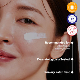 Model applying Cell Fusion C to cheek showing no white cast and smooth finish