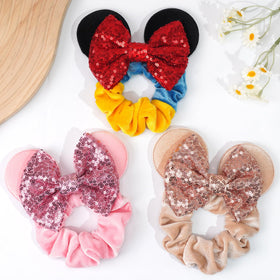 CellElection scrunchie worn in ponytail, adds sparkle to everyday styles