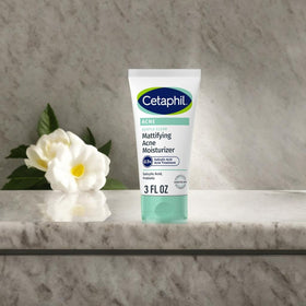 Cetaphil bottle in hand for scale and portable 3 oz travel-friendly convenience