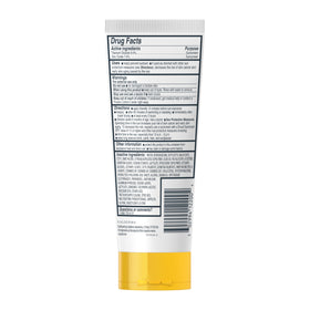 Person applying Cetaphil at beach showing water resistant outdoor protection