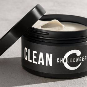 Challenger rinsing under water to show water-soluble formula and easy cleanup