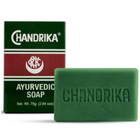 Chandrika soap lather in hand demonstrating rich foam and easy rinsing benefit