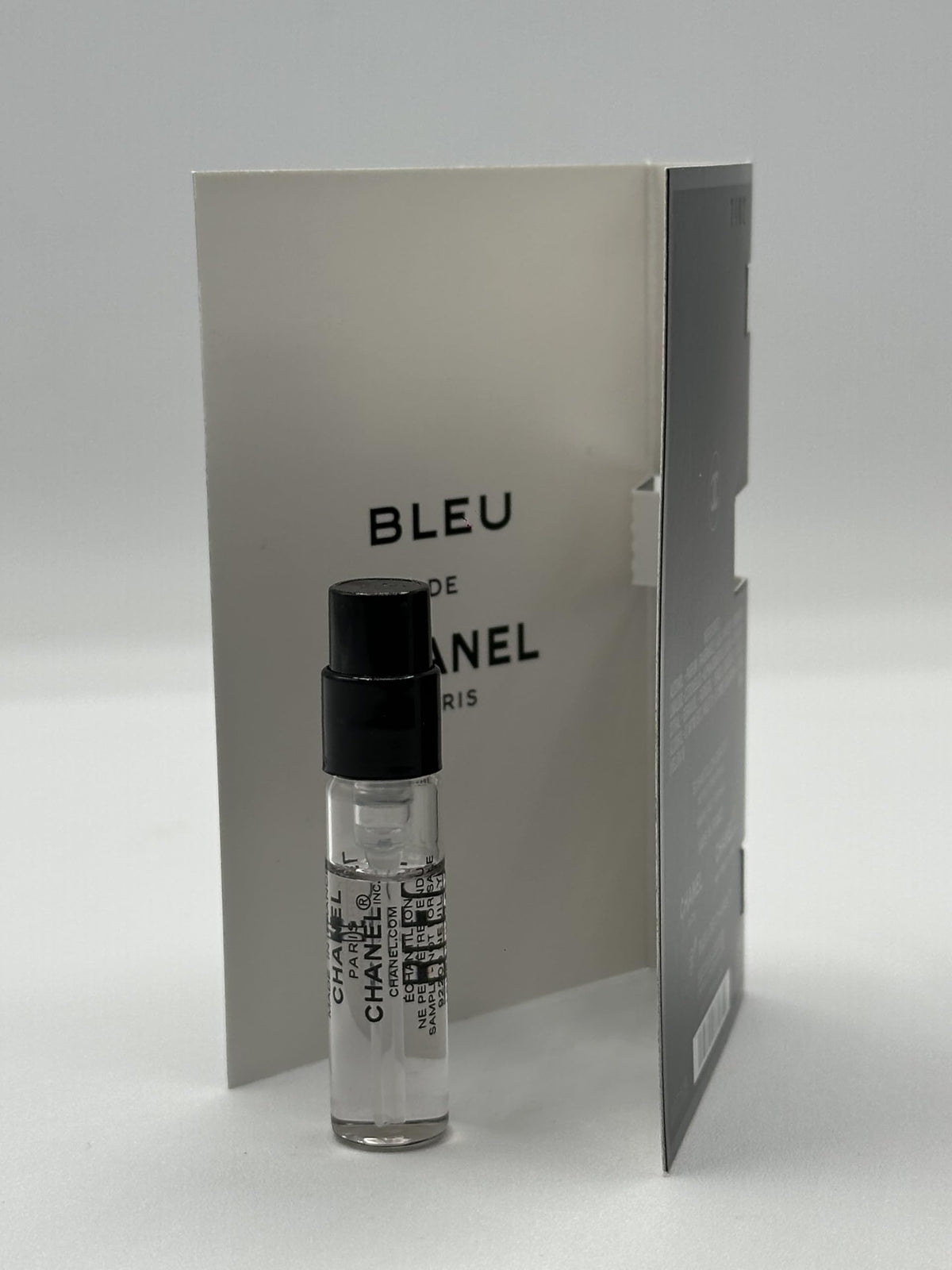 CHANEL sample vial on dressing table conveying Bleu de Chanel elegance for daily wear