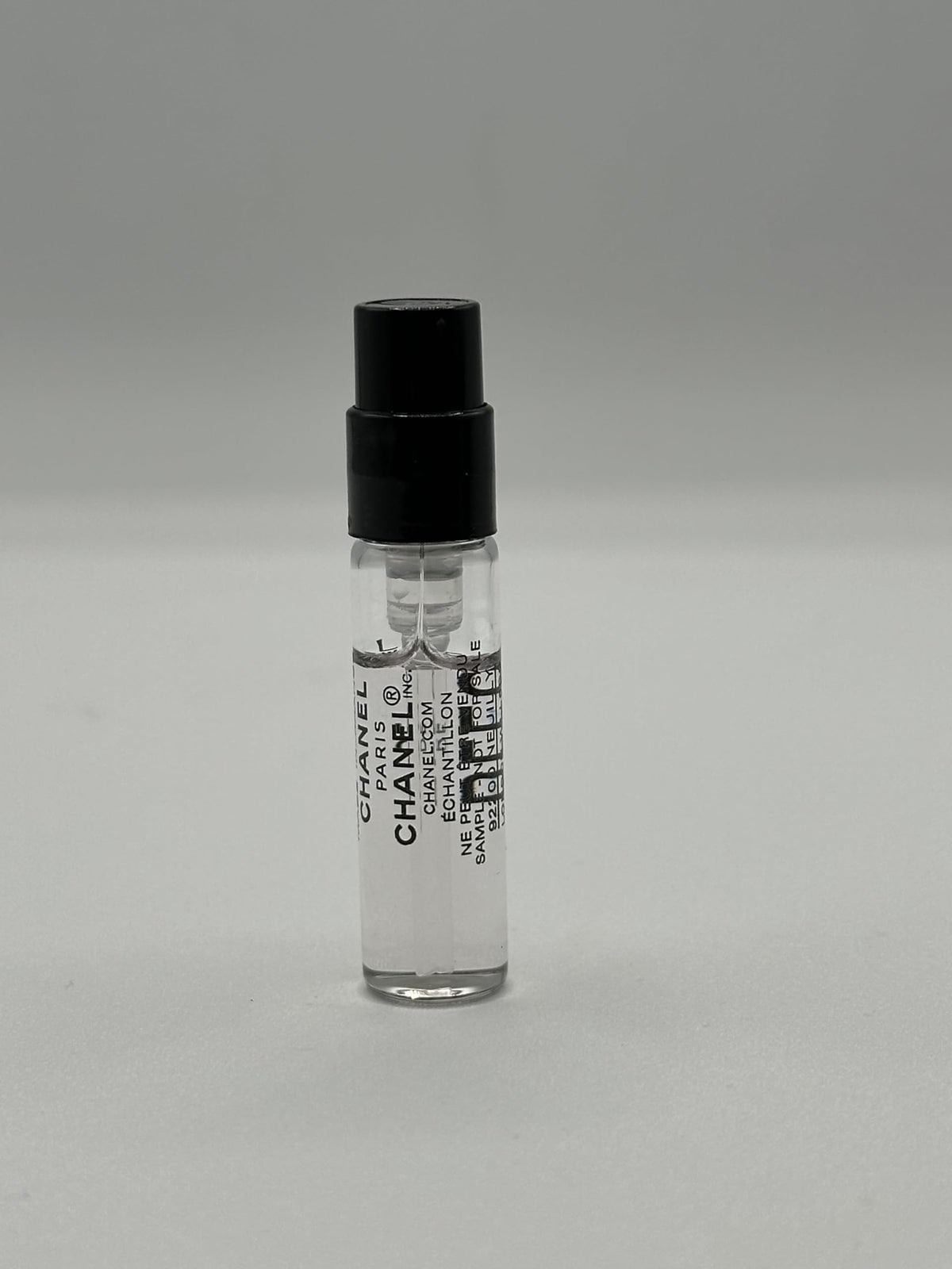 CHANEL cap and sample label close-up highlighting authenticity and readable marking