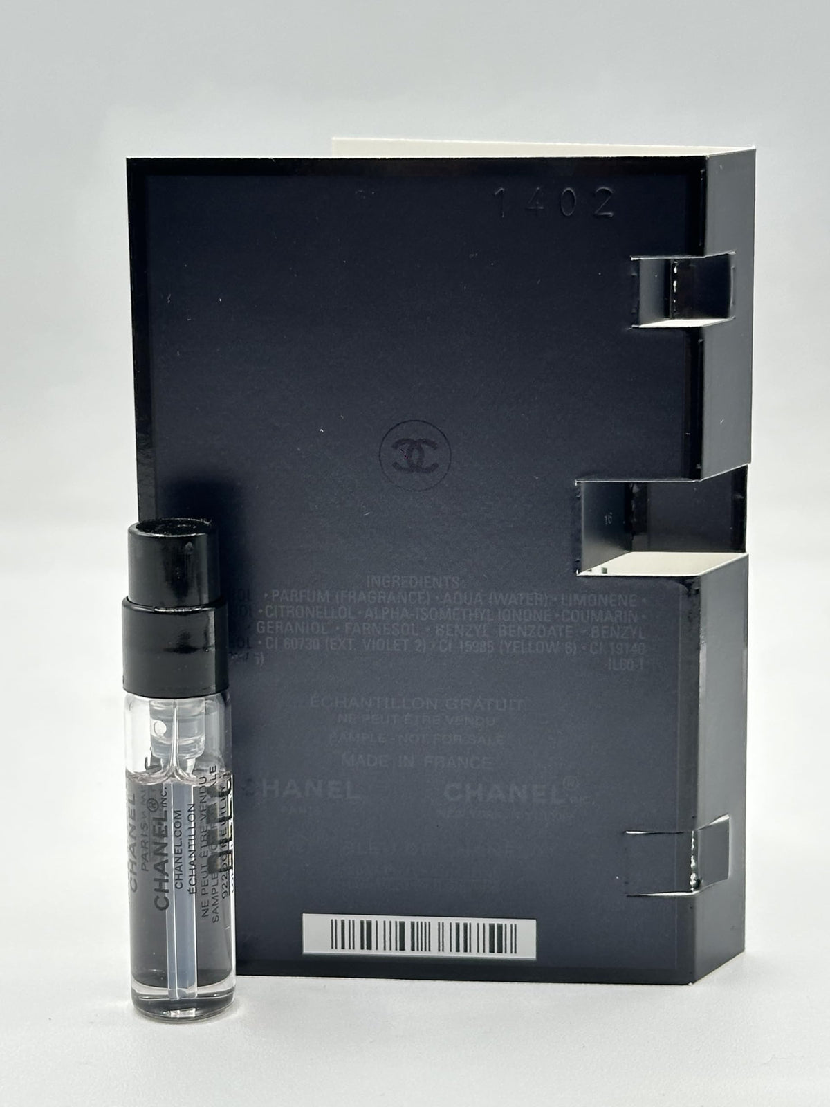 CHANEL vial in hand to show 1.5ml size and travel-friendly convenience
