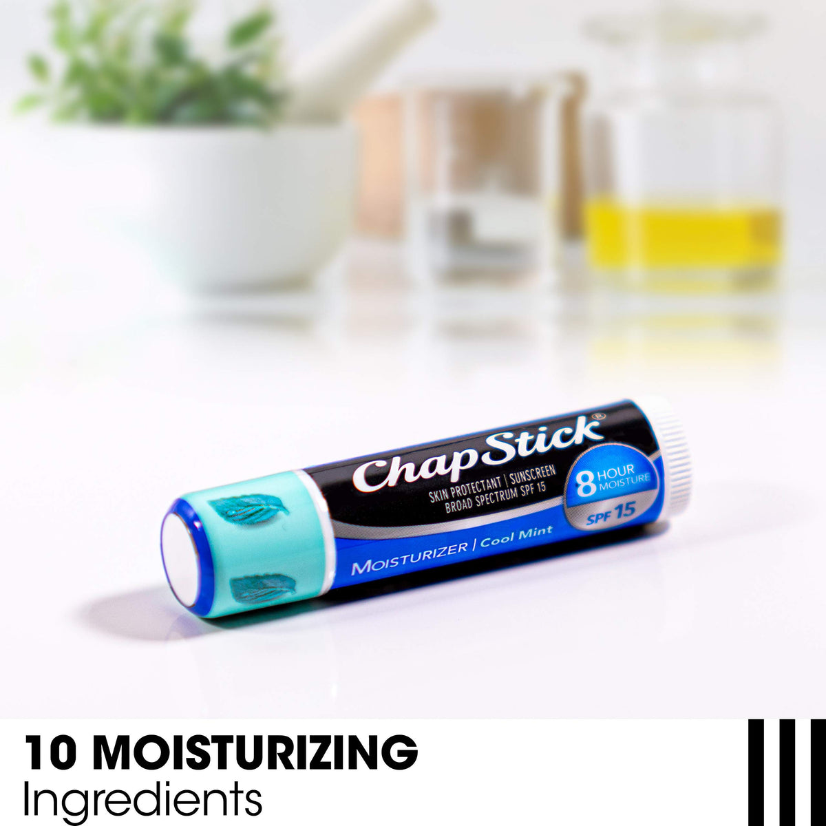 ChapStick open cap with visible label highlighting ingredients like aloe and vitamin E