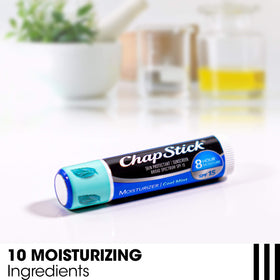 ChapStick open cap with visible label highlighting ingredients like aloe and vitamin E