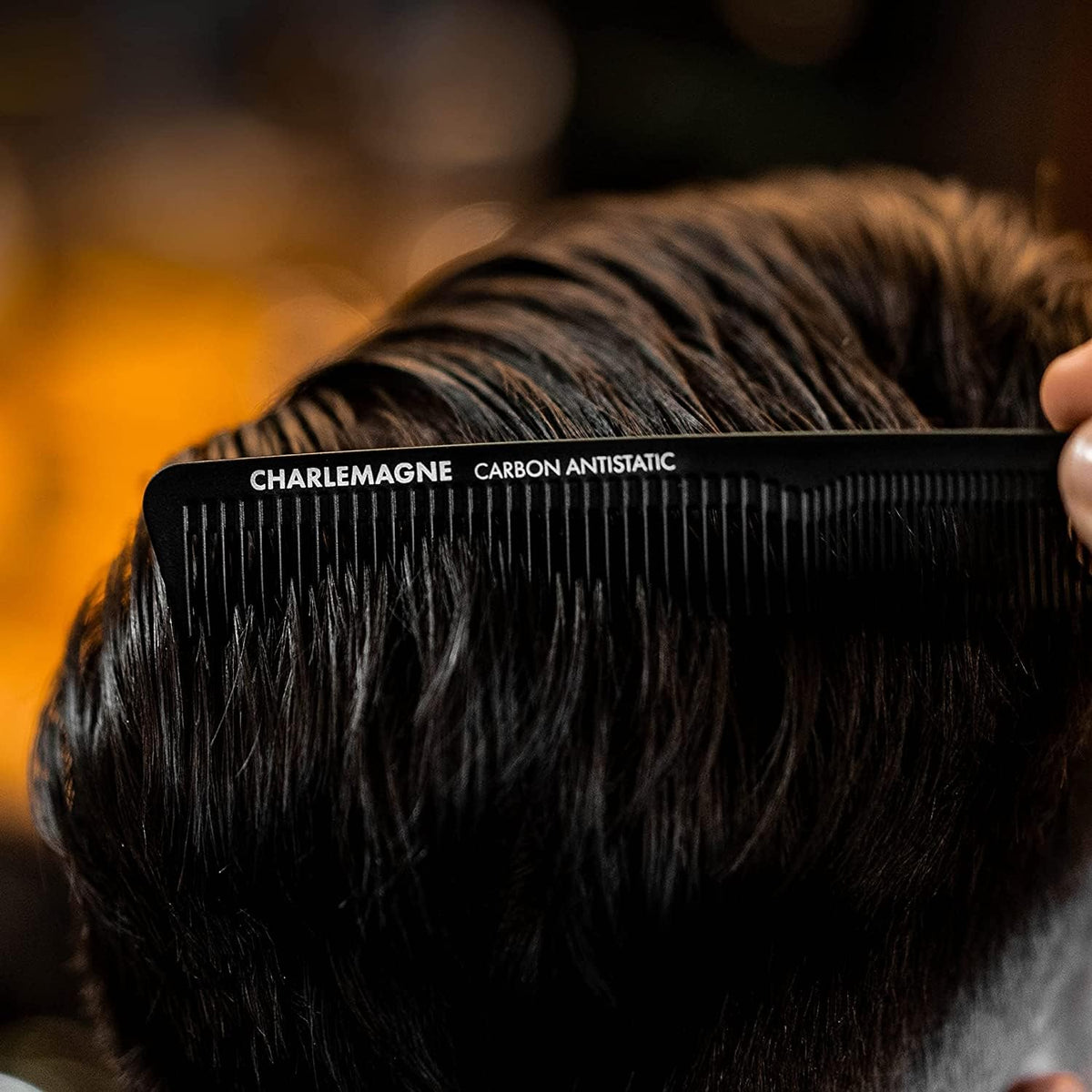 Charlemagne comb tucked into a jacket pocket showing portability and travel convenience