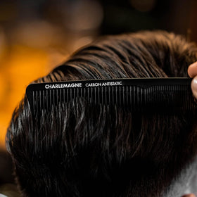 Charlemagne comb tucked into a jacket pocket showing portability and travel convenience