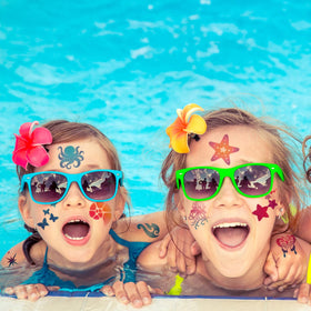 CHARLENT kids wearing glitter tattoos at pool party adding playful flair