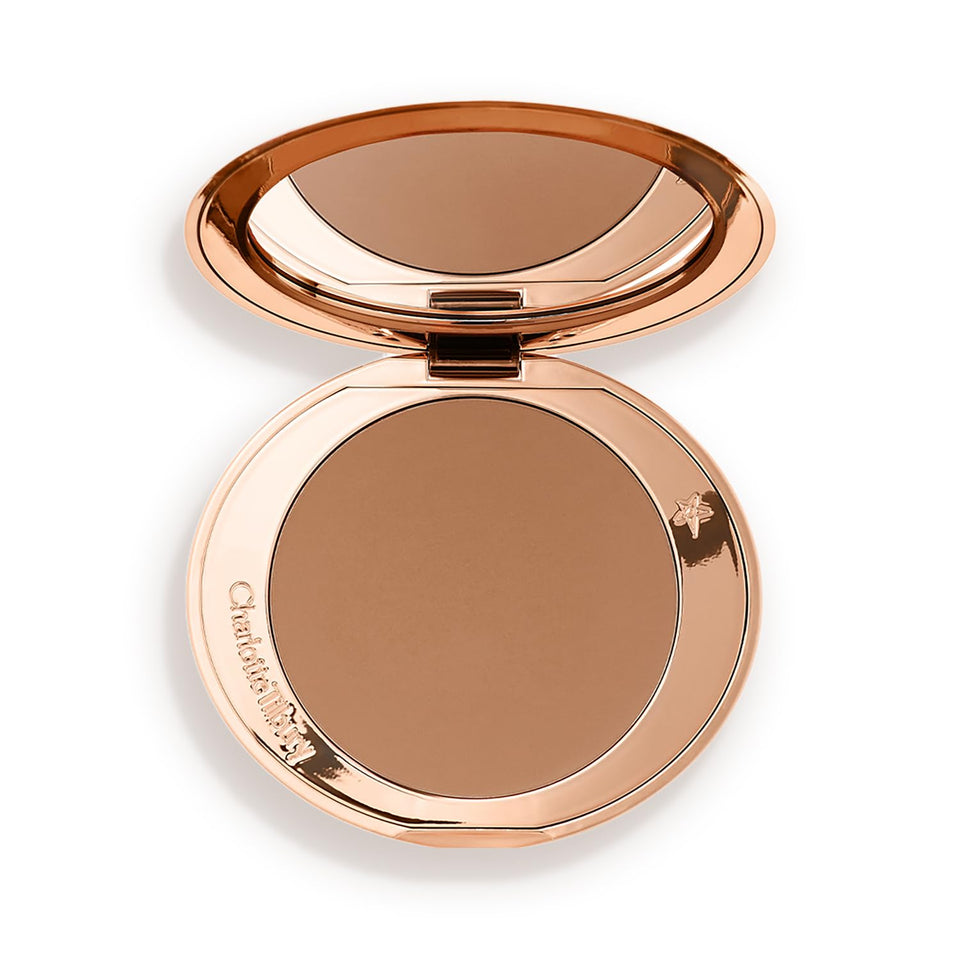 Charlotte Tilbury compact front view showing sleek refillable design and portable benefit