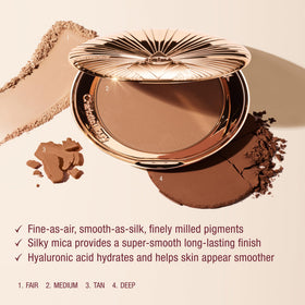 Charlotte Tilbury bronzer applied on model cheek for instant sun-kissed contour and radiance