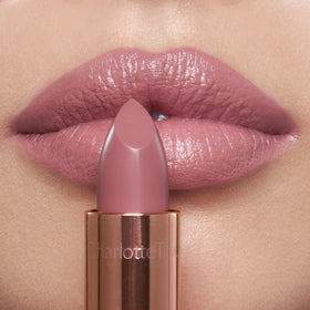 Charlotte Tilbury closeup lips wearing pillow talk fair for luminous fuller look