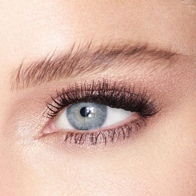Charlotte Tilbury eyeshadow applied on eyelid demonstrating luminous, eye-brightening effect
