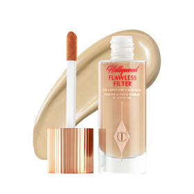 Charlotte Tilbury bottle front view showing elegant packaging and glow benefit
