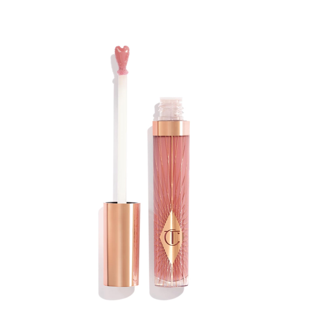 Charlotte Tilbury front tube showing Pillow Talk Fair and glossy finish benefit