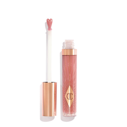 Charlotte Tilbury front tube showing Pillow Talk Fair and glossy finish benefit