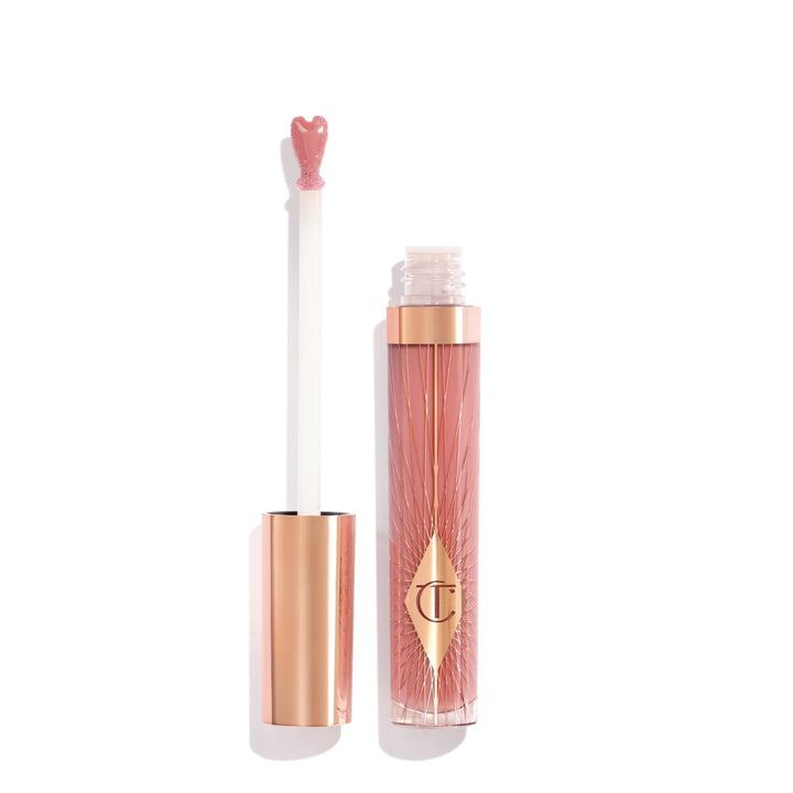 Charlotte Tilbury front tube showing Pillow Talk Fair and glossy finish benefit