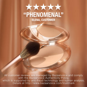 Charlotte Tilbury compact inside a handbag ready for on‑the‑go touchups
