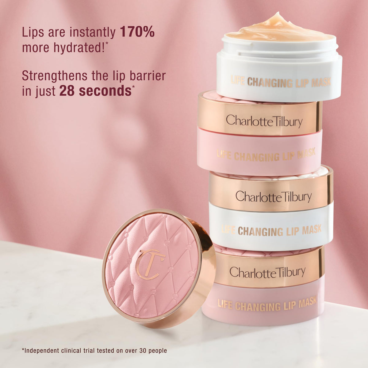 Charlotte Tilbury jar beside a coin for size and portability reference