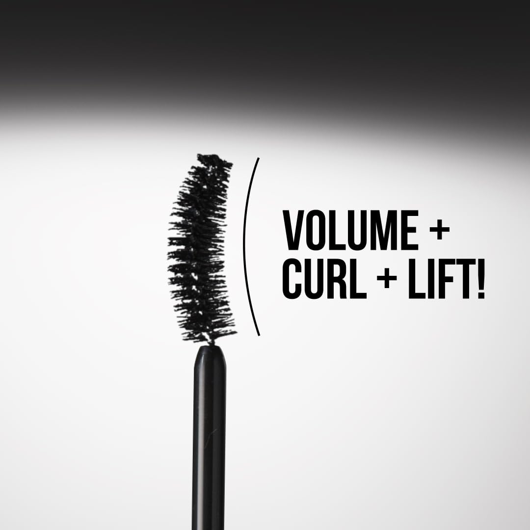 Charlotte Tilbury mascara next to coin scale showing compact travel-friendly size